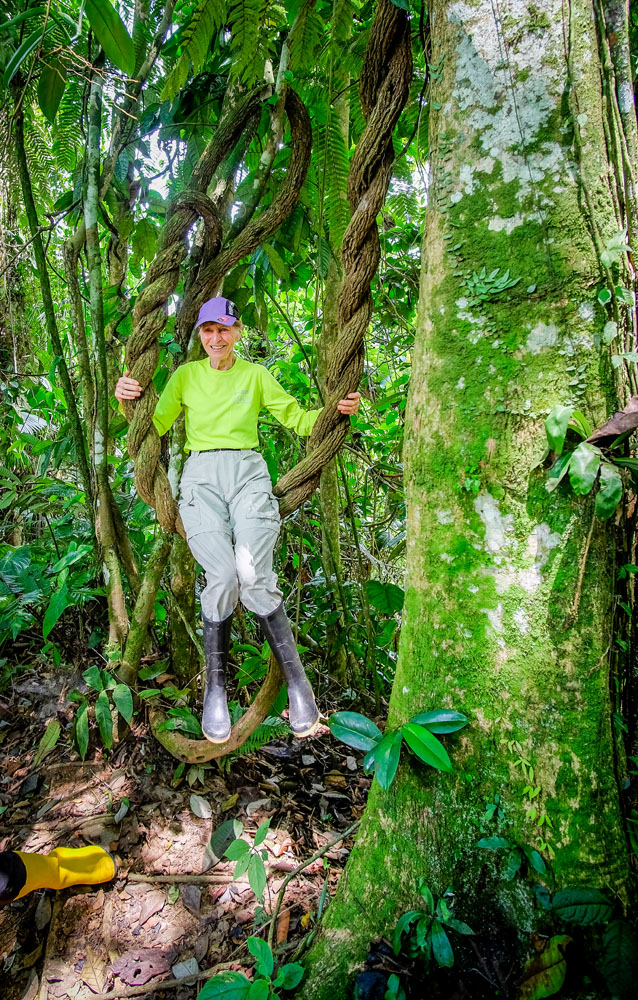 Ane holding a vine in the Amazon jungle